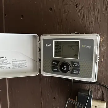 Orbit B-hyve Wi-Fi smart sprinkler controller mounted and wired