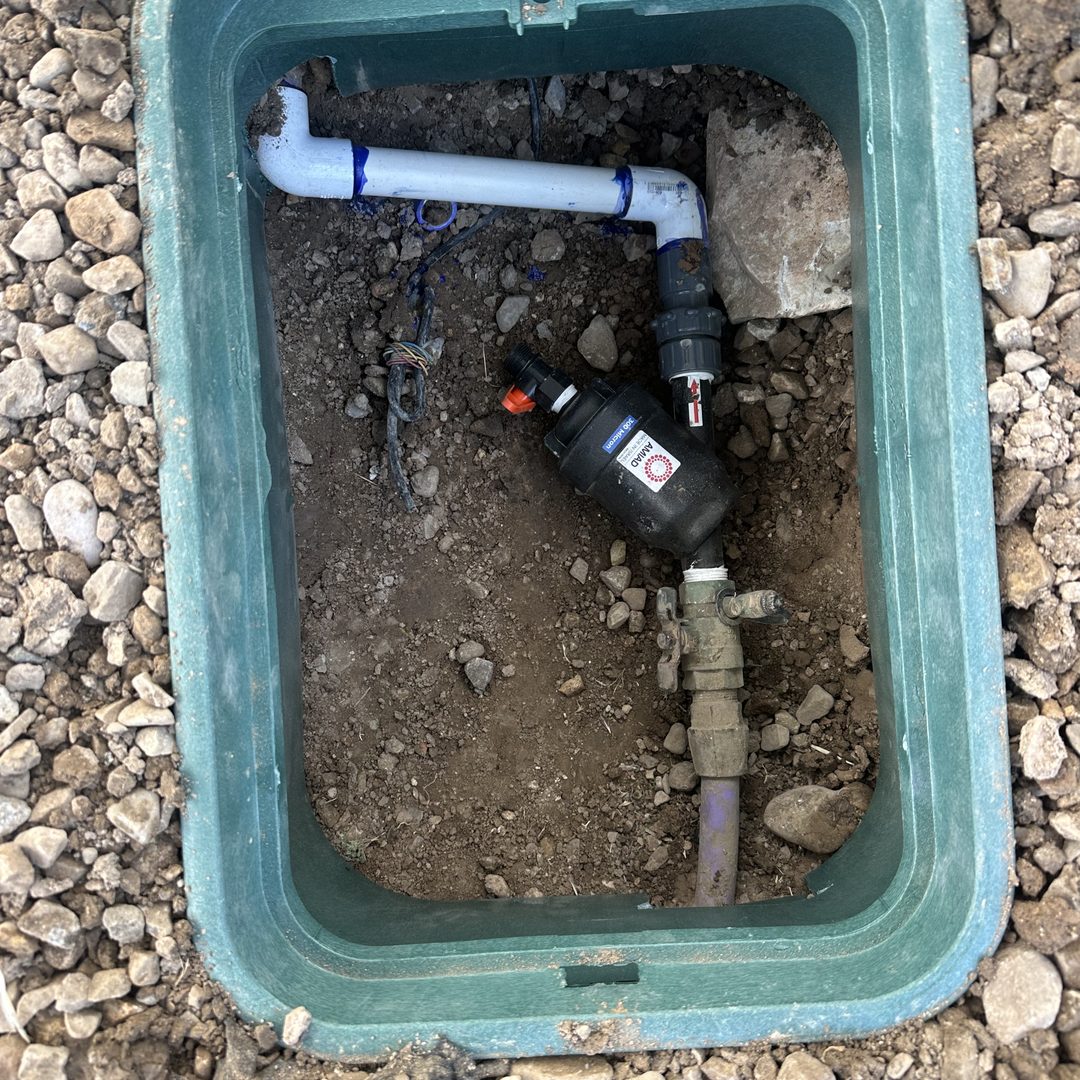 New valve and inline filter installed inside a valve box